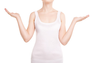 Image showing Woman holding something imaginary on white