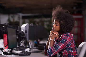 Image showing a young African American woman feels tired in the modern office