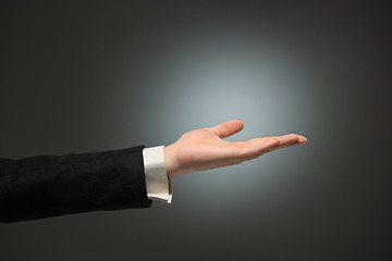 Image showing Dressed in a business suit caucasian male hand