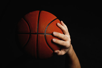 Image showing Basketball ball in male hands