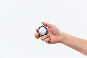 Image showing hand holding a stopwatch against a white background