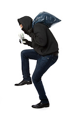 Image showing Thief with bag on shoulders