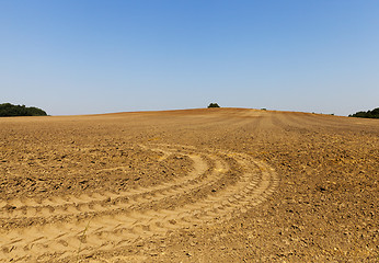 Image showing Wheel tracks on the field