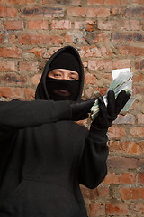 Image showing Burglar with packet of money