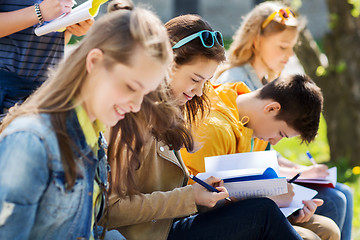 Image showing group of students with notebooks at school yard