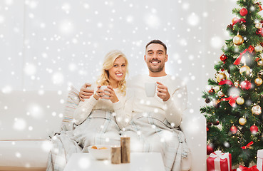 Image showing happy couple at home with christmas tree