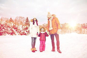 Image showing happy family with child in winter clothes outdoors