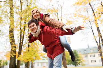 Image showing happy young couple having fun in autumn park