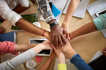 Image showing close up of international students hands on top