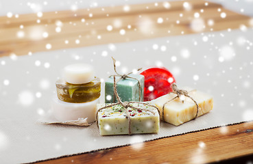 Image showing handmade soap bars on wood