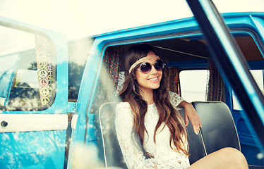 Image showing smiling young hippie woman in minivan car