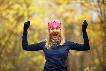 Image showing Young happy woman doing exercises