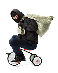 Image showing Thief with bag on bicycle