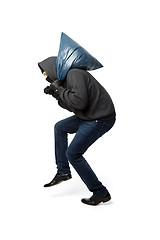 Image showing Robber slinking with large bag