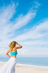 Image showing portrait of young pretty woman looking to the ocean 