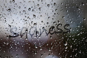 Image showing Sadness written on rainy window