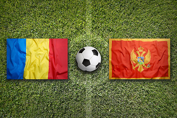 Image showing Romania vs. Montenegro flags on soccer field