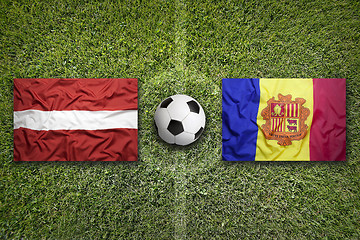 Image showing Latvia vs. Andorra flags on soccer field