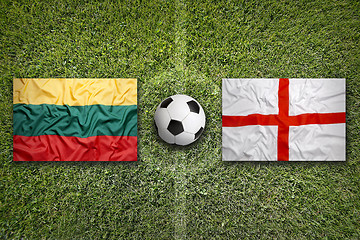 Image showing Lithuania vs. England flags on soccer field