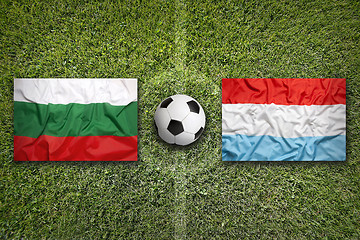 Image showing Bulgaria vs. Luxembourg flags on soccer field