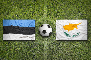 Image showing Estonia vs. Cyprus flags on soccer field