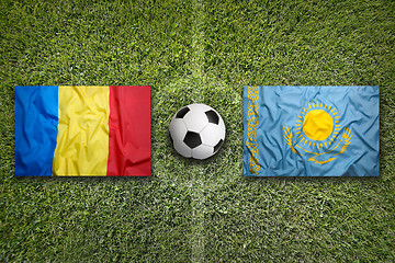 Image showing Romania vs. Kazakhstan flags on soccer field