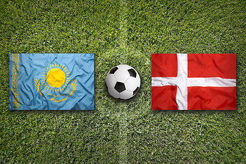 Image showing Kazakhstan vs. Denmark flags on soccer field