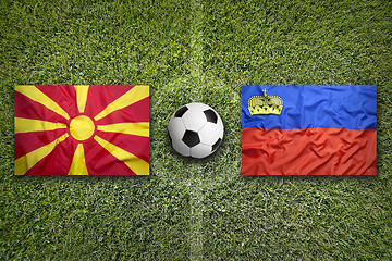 Image showing Liechtenstein vs. Macedonia flags on soccer field