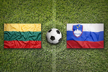 Image showing Lithuania vs. Slovenia flags on soccer field