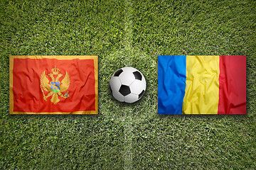 Image showing Montenegro vs. Romania flags on soccer field