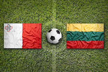 Image showing Malta vs. Lithuania flags on soccer field