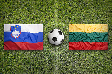 Image showing Slovenia vs. Lithuania flags on soccer field