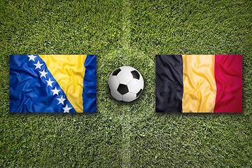 Image showing Bosnia and Herzegovina vs. Belgium flags on soccer field