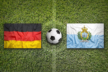 Image showing Germany vs. San Marino flags on soccer field