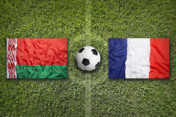 Image showing Belarus vs. France flags on soccer field