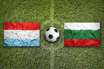 Image showing Luxembourg vs. Bulgaria flags on soccer field