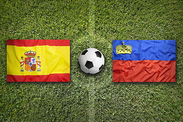 Image showing Spain vs. Liechtenstein flags on soccer field