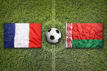 Image showing France vs. Belarus flags on soccer field