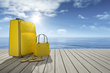 Image showing some luggage on a wooden jetty