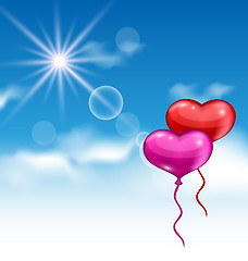 Image showing Two glossy hearts balloons for Valentine Day flying in the blue 