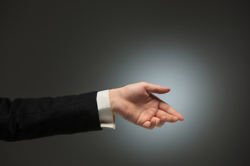 Image showing Dressed in a business suit caucasian male hand