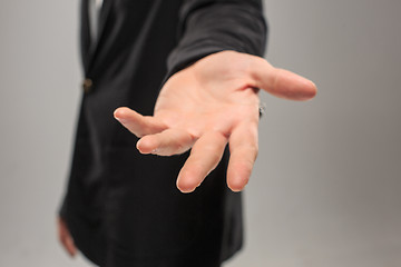 Image showing Dressed in a business suit caucasian male hand