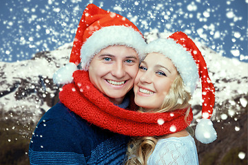 Image showing Lovely christmas couple in Santa Claus hats