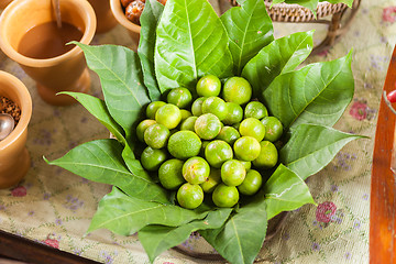 Image showing Limes in leaves