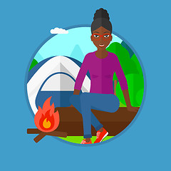 Image showing Woman sitting on log in the camping.