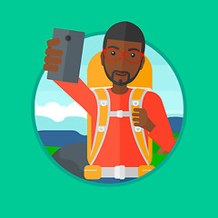 Image showing Tourist with backpack making selfie.