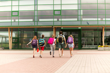 Image showing group of happy elementary school students running