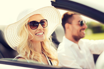 Image showing happy man and woman driving in cabriolet car