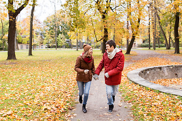 Image showing happy young couple running in autumn park