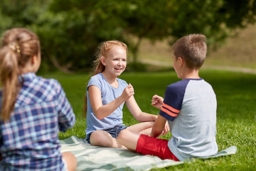 Image showing happy kids playing rock-paper-scissors game